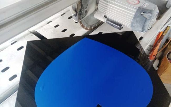 Granite panel on saw.